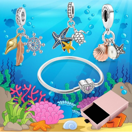 Bracelet avec trois charms coeur étoile de mer coquillage gouvernail argent