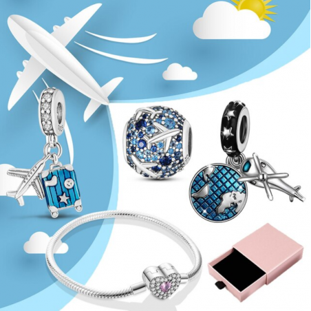 Bracelet avec trois charms coeur hélicoptère planète valise argent