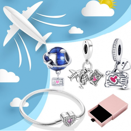 Bracelet avec trois charms coeur avion valise planète argent