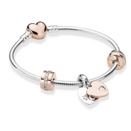 Bracelet avec trois charms double coeur or rose clip strass